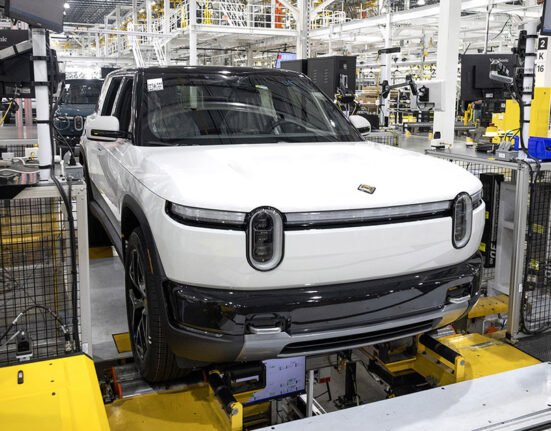 Rivian cuts hundreds of jobs as it introduces new EV