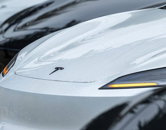 Tesla sued after woman dies after car crashes into house