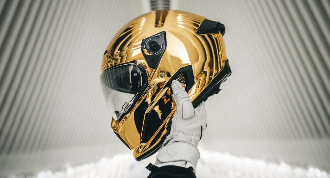 This gold chrome motorcycle helmet might be the boldest statement of all. glare must be wild