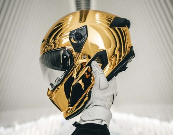This gold chrome motorcycle helmet might be the boldest statement of all. glare must be wild