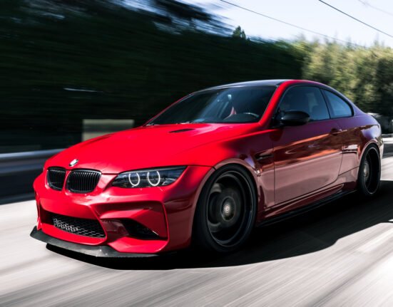 Why did so many German performance cars limit their top speeds to 155 MPH?
