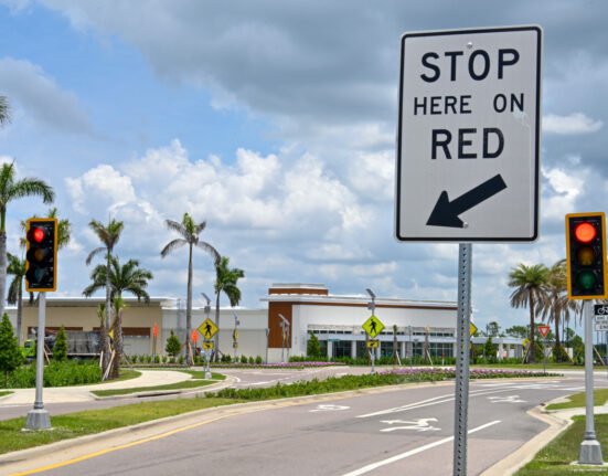 Why is a Florida city installing traffic lights at intersections?
