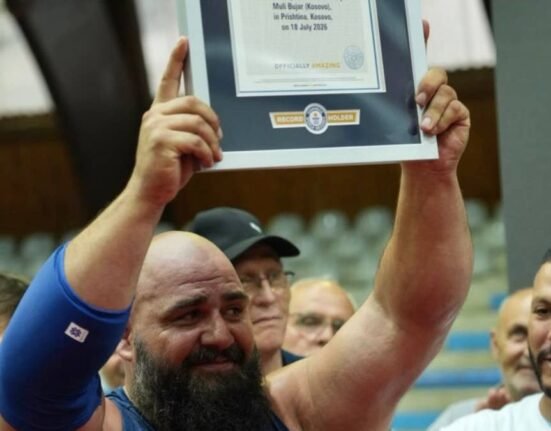 "Hulk of Kosova" sets Guinness record by placing two tons of cement on his chest