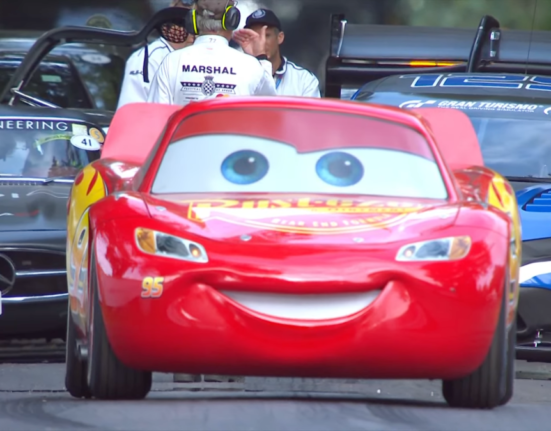 Kaa-chow! Lightning McQueen races the bus up the Goodwood Hill climb