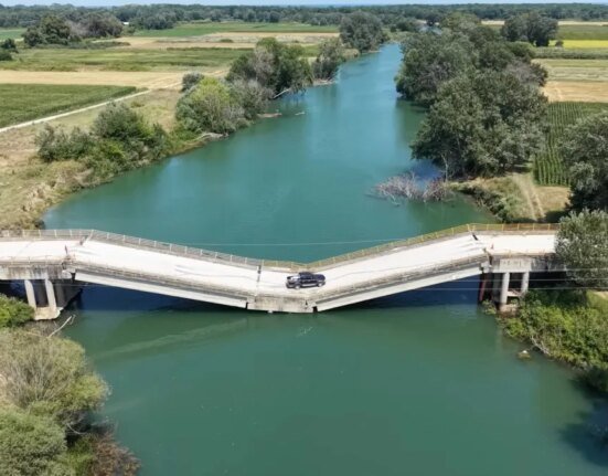 Locals keep driving on this inclined bridge because it is faster than the detour
