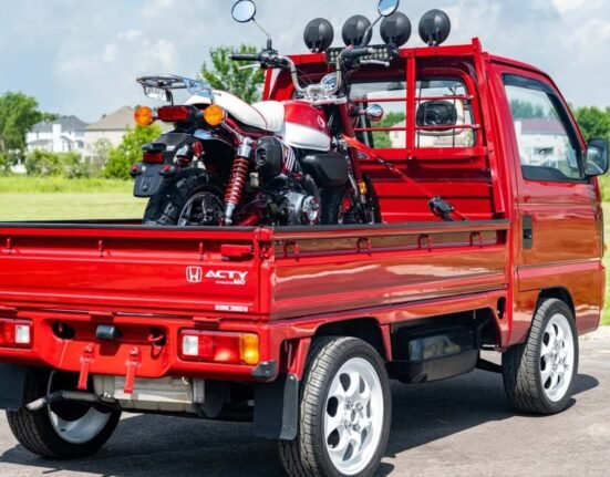 This Honda Kei truck comes with a mini moto monkey on its back. it's perfect