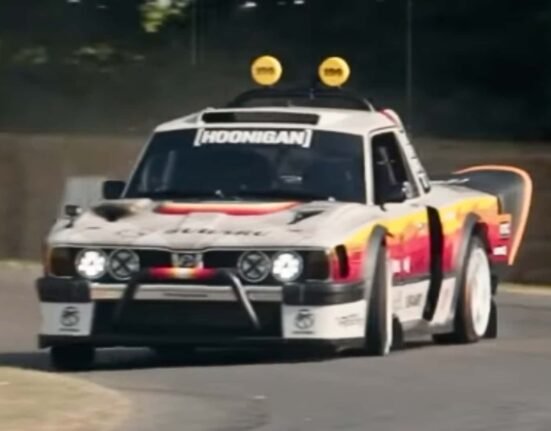 Travis Pastrana makes his way up the Goodwood Hill climb in his 670-hp custom Subaru