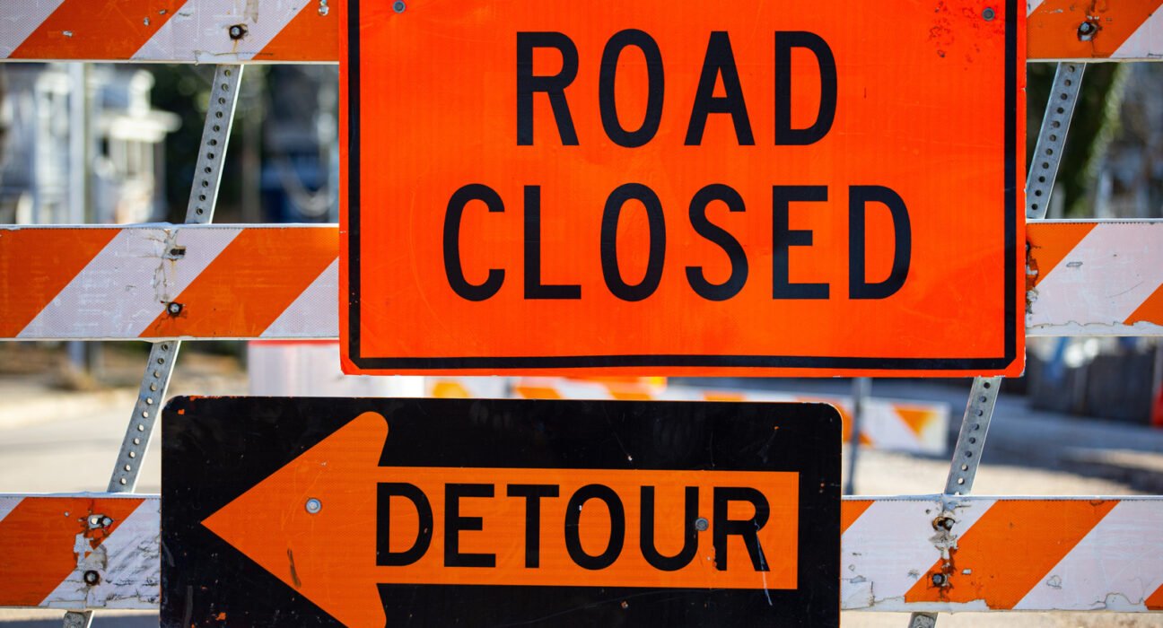 Why are construction zone signs orange while all other warning signs remain yellow?