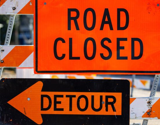 Why are construction zone signs orange while all other warning signs remain yellow?