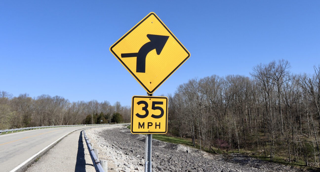 Why are some speed limit signs yellow?