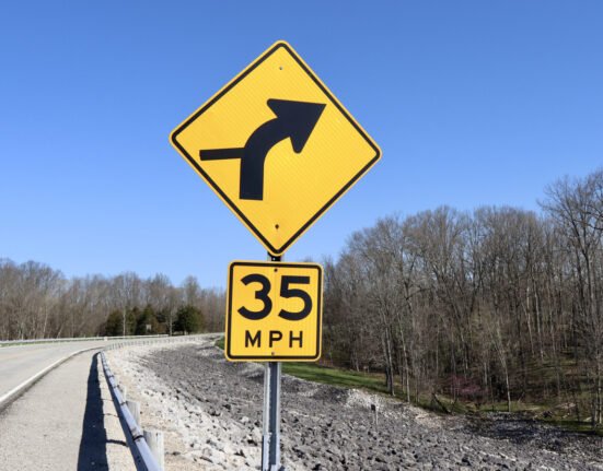 Why are some speed limit signs yellow?