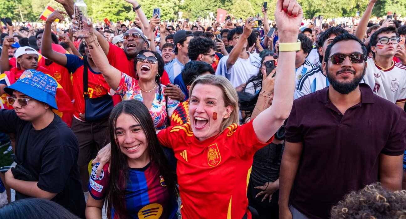 Why do we watch sports with strangers?