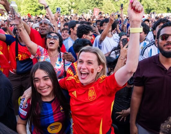 Why do we watch sports with strangers?